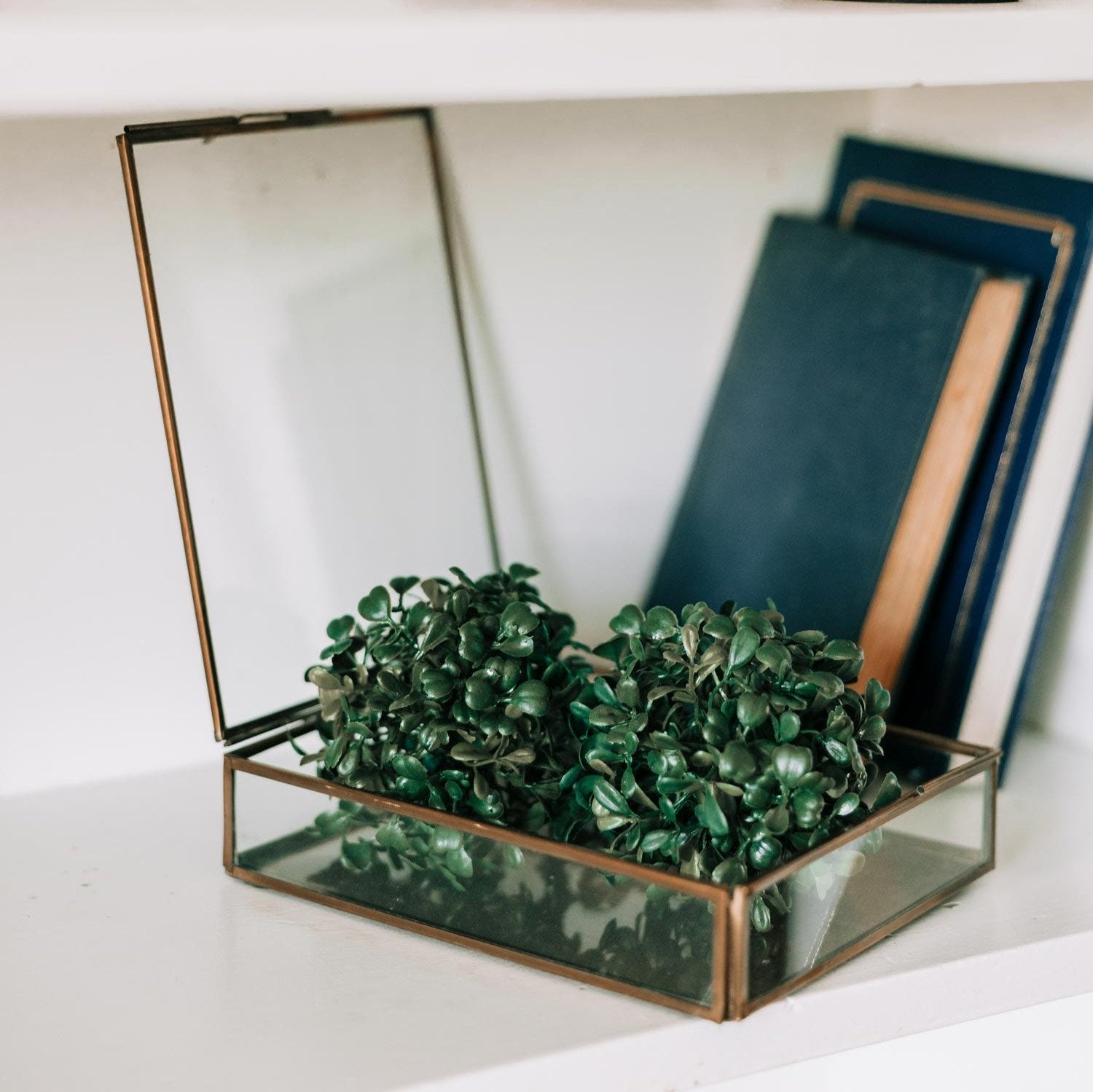Elegant antique brass keepsake box displaying colorful trinkets from different angles.