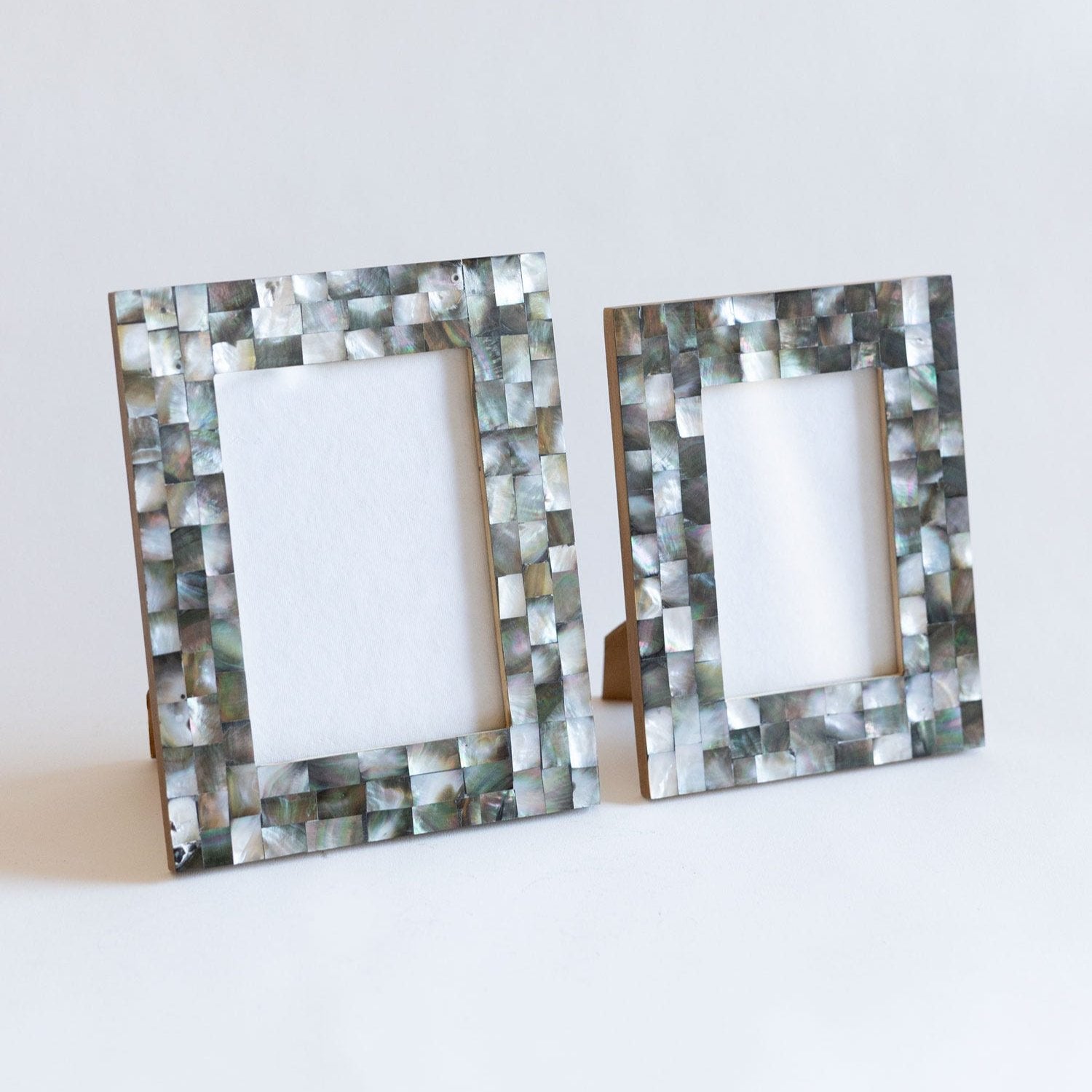 Close-up of the mother of pearl shells in the charcoal grid picture frame, showcasing intricate craftsmanship
