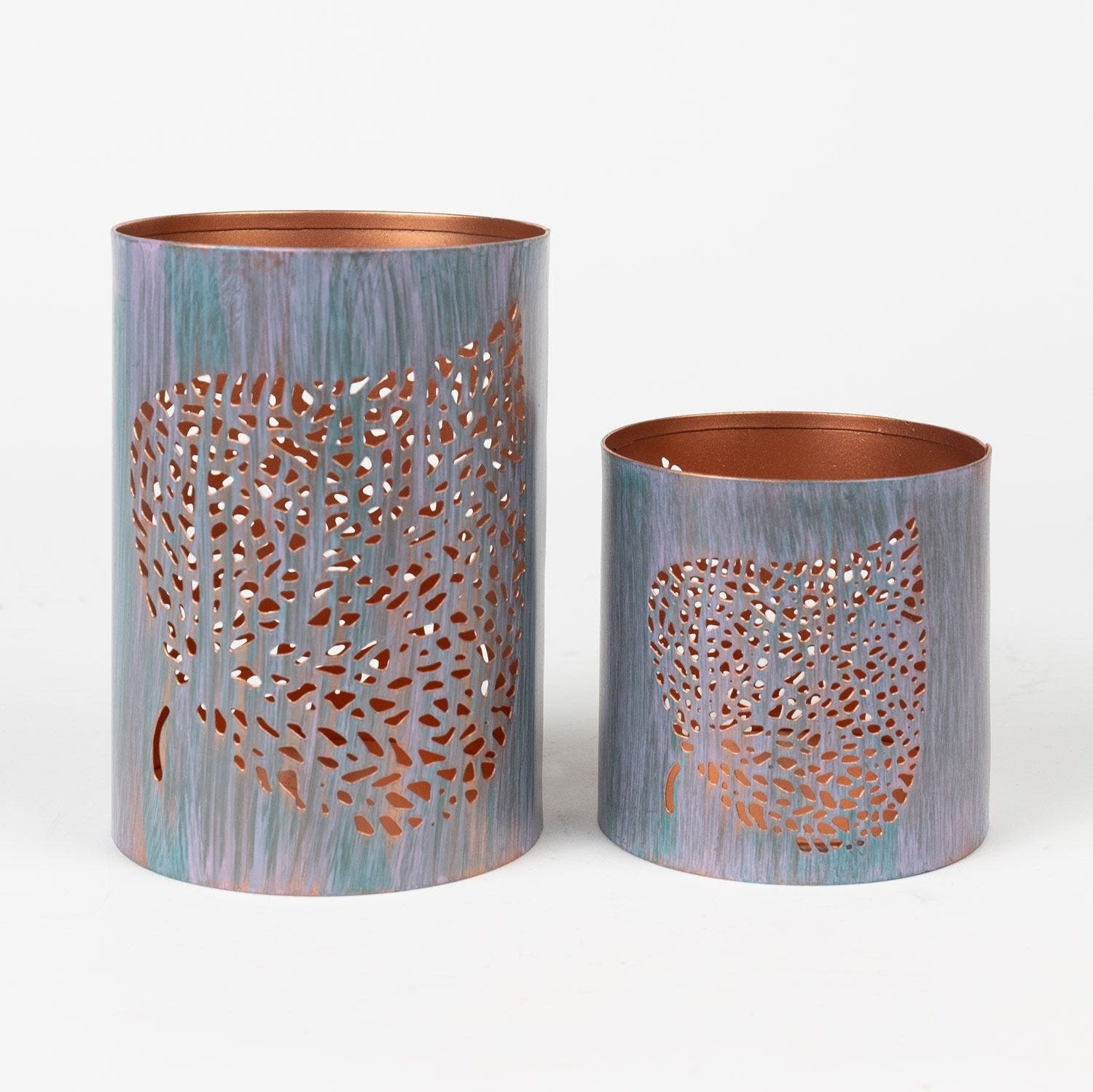 Side view of the Spiritual Bodhi Leaf Candleholder with lit candle, highlighting the copper finish.