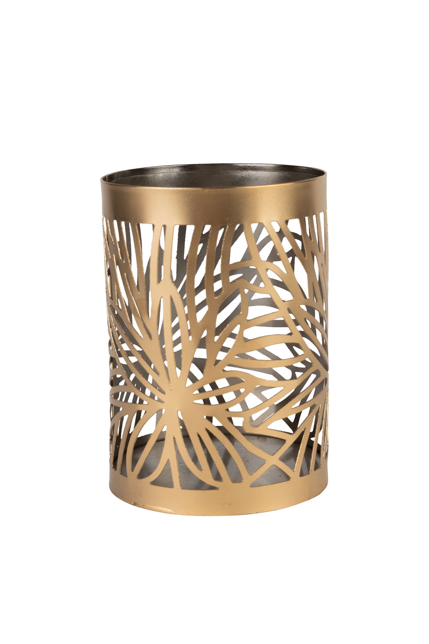 Close-up of the palm leaf cutout patterns on the candleholder illuminated at night