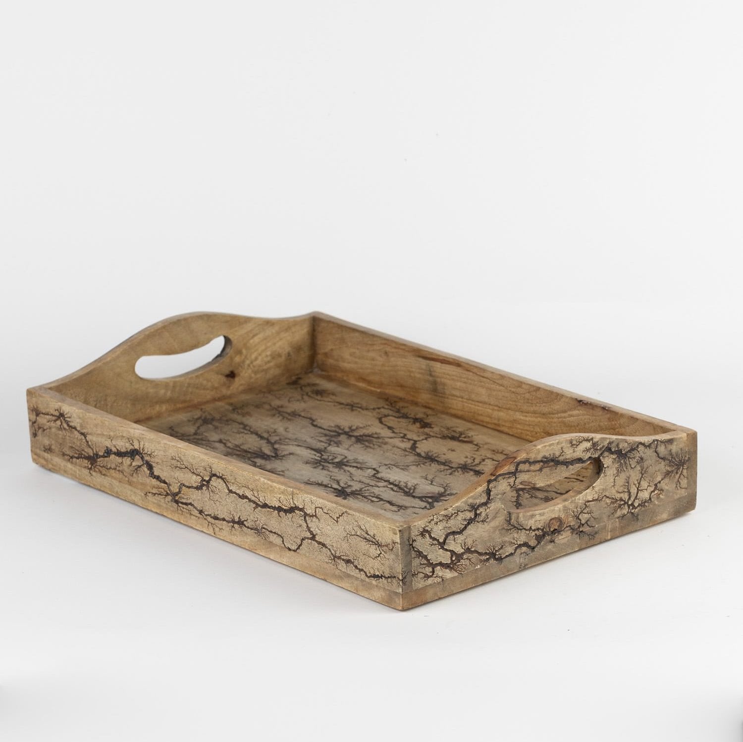 Close-up of roots motif handle tray for serving breakfast in bed