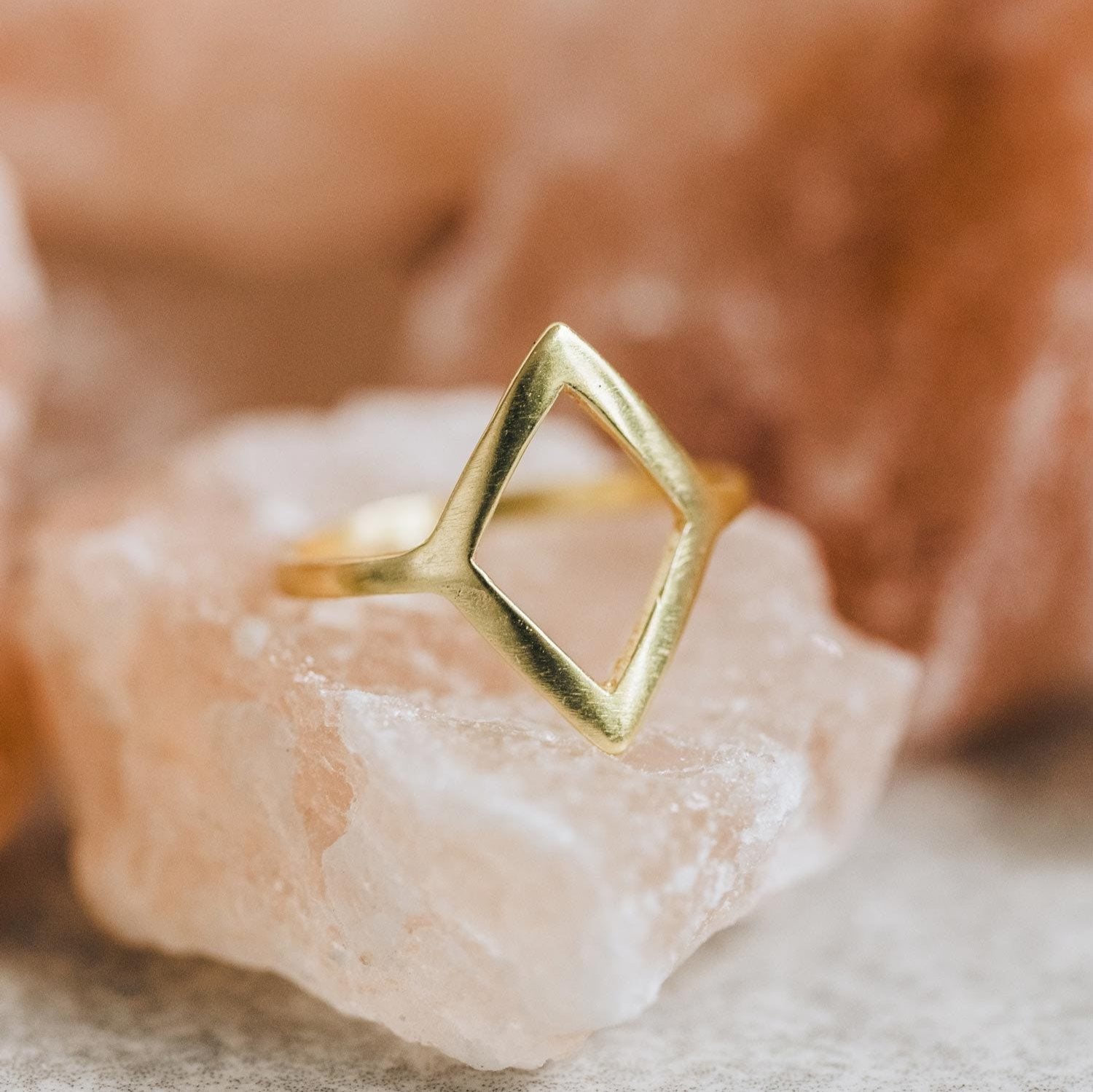 Close-up view of the stunning open diamond brass ring showcasing its intricate design and sparkling diamond.