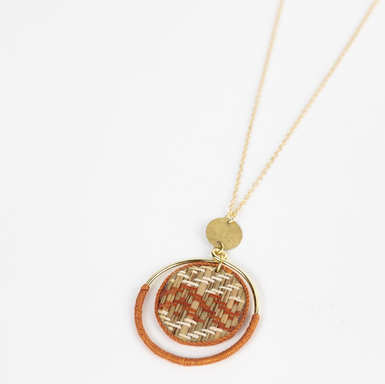 Close-up view of the Celestial Harmony Artisan Necklace, highlighting the intricate weaving of madurakathi grass and beads.