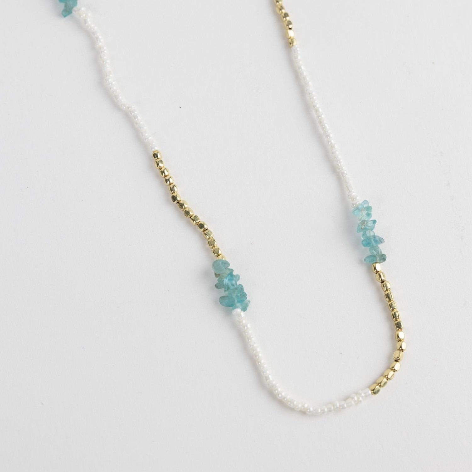 Close-up of Ekiya beaded necklace showcasing pearl and gold beads