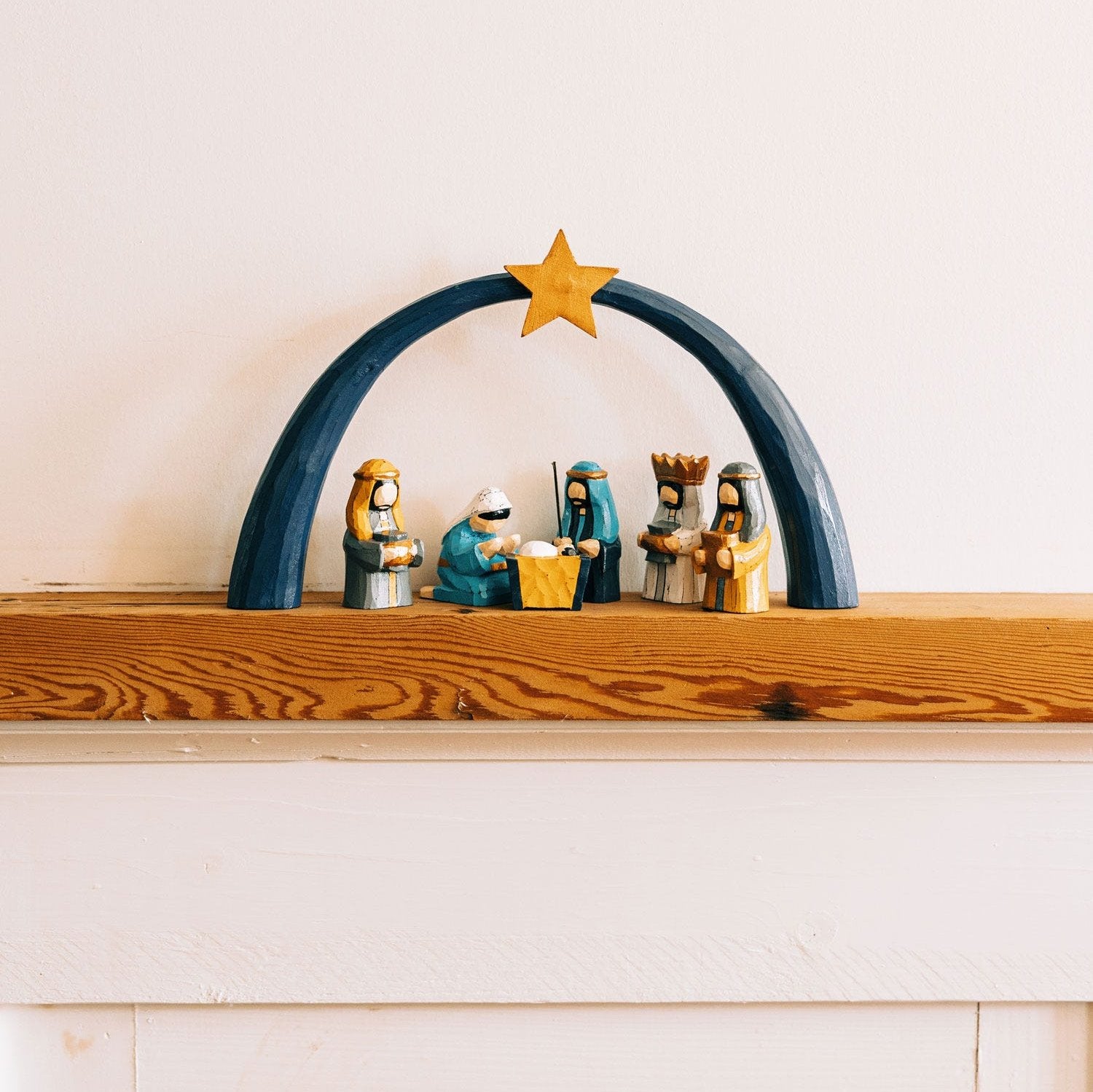 Artisan Night Arch Nativity Set showcasing intricate hand-carvings and vibrant colors.