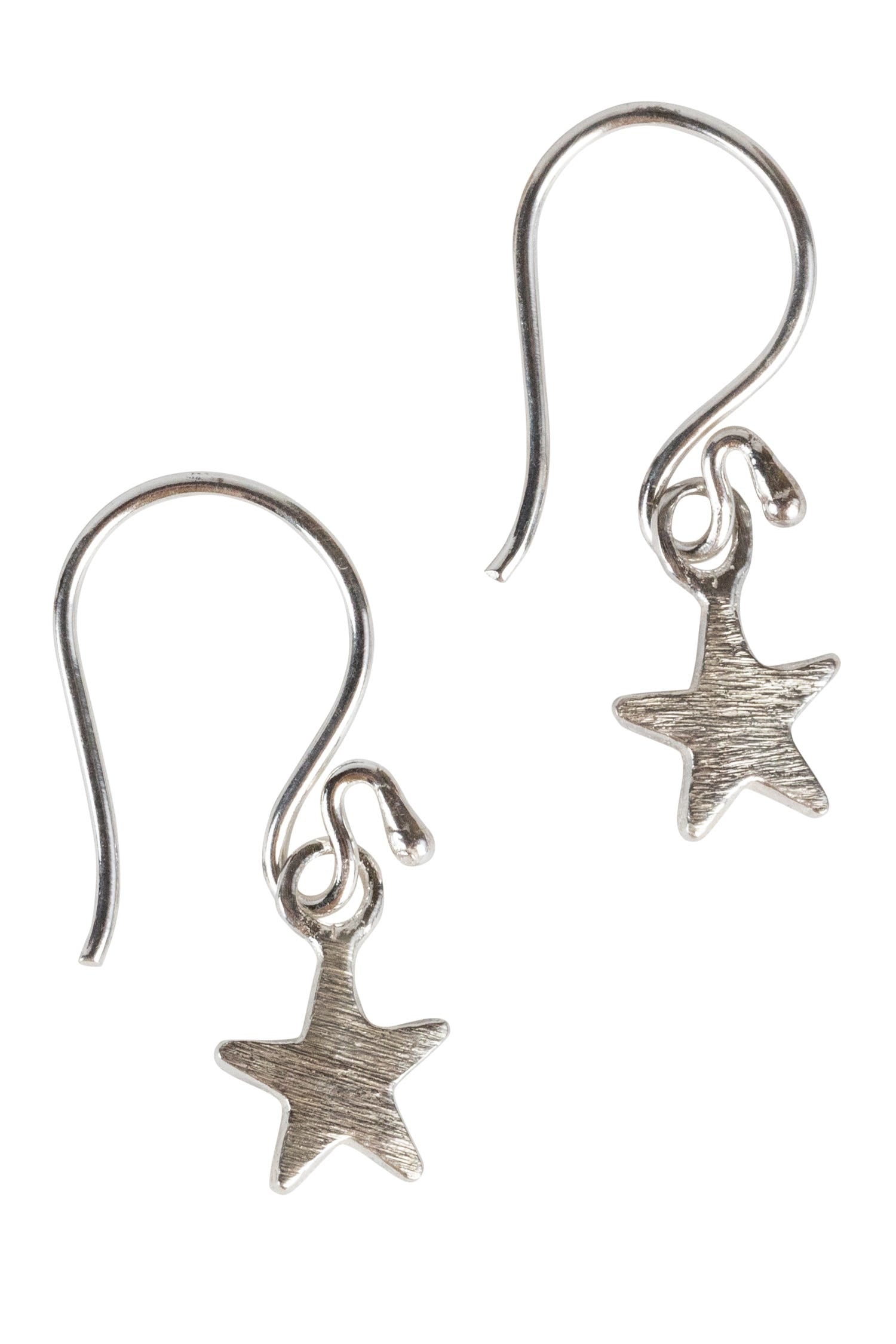 Brushed sterling silver celestial earrings worn at a festive event.