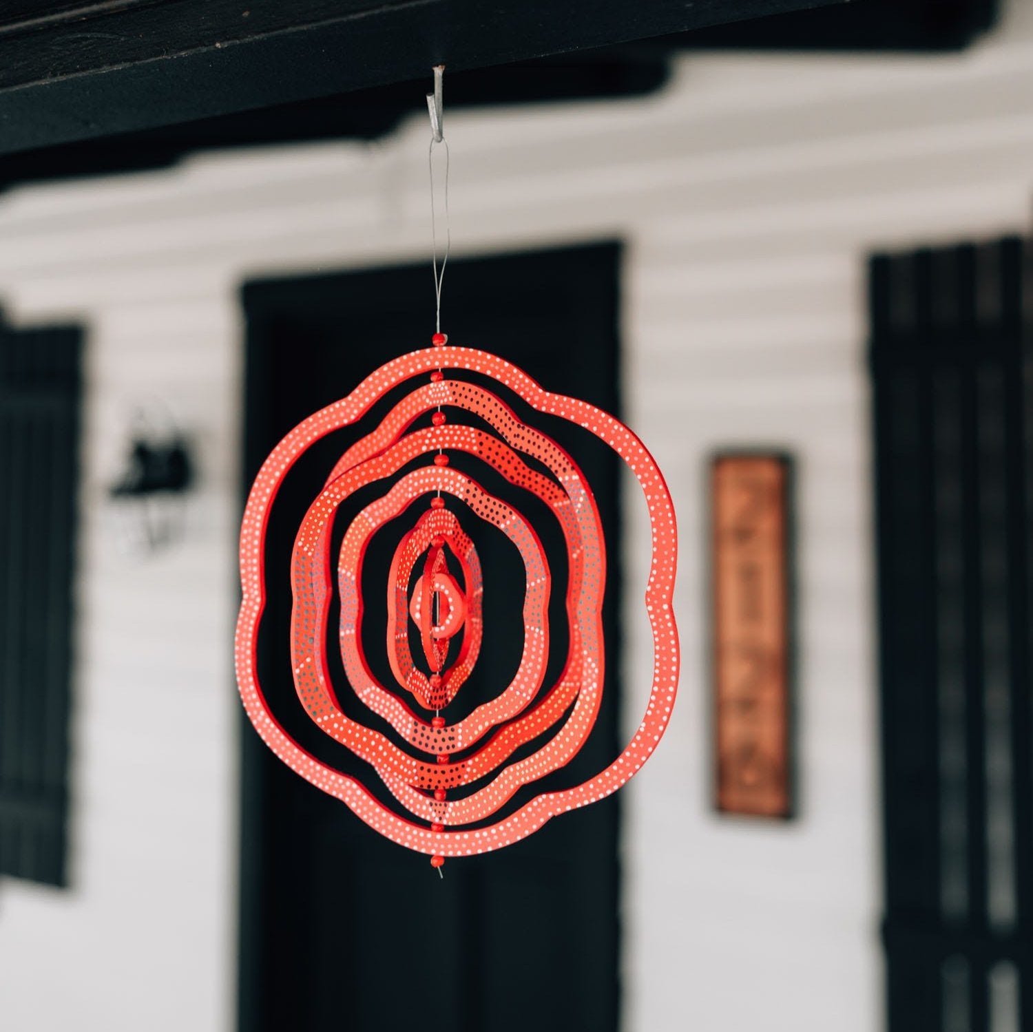 Close-up of the whimsical glass bead wind spinner showcasing its vibrant colors and craftsmanship.