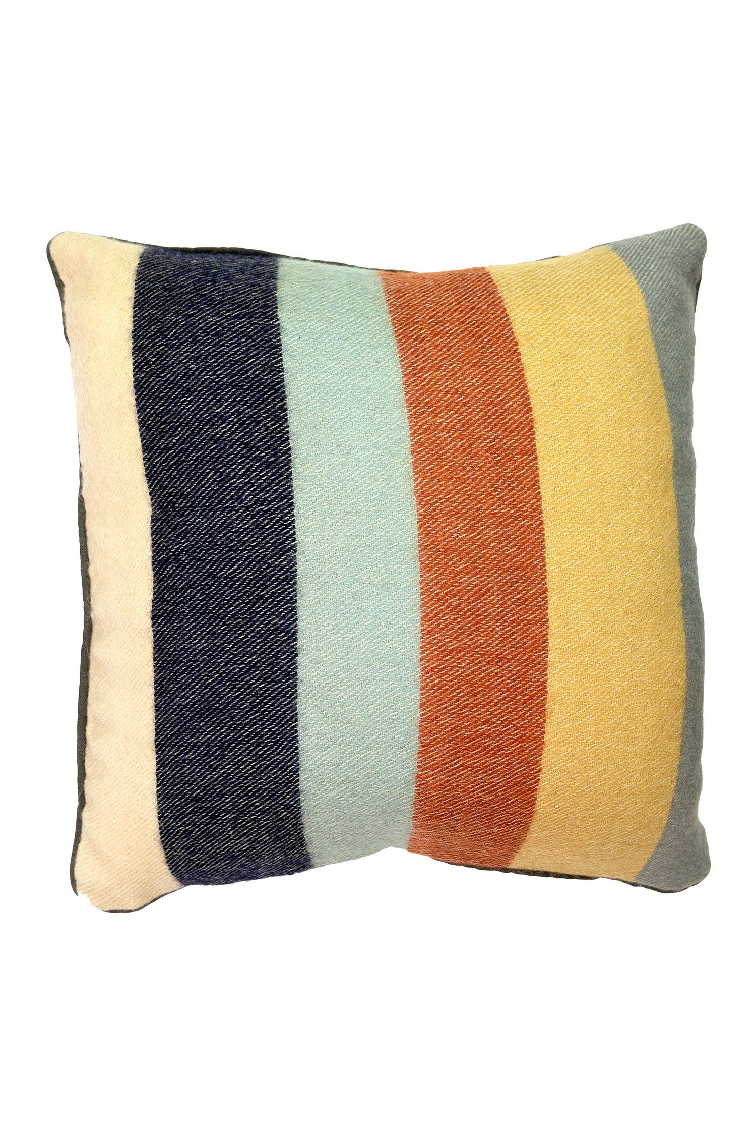 Artisan striped handwoven pillow placed on a stylish sofa, highlighting its unique design and texture.