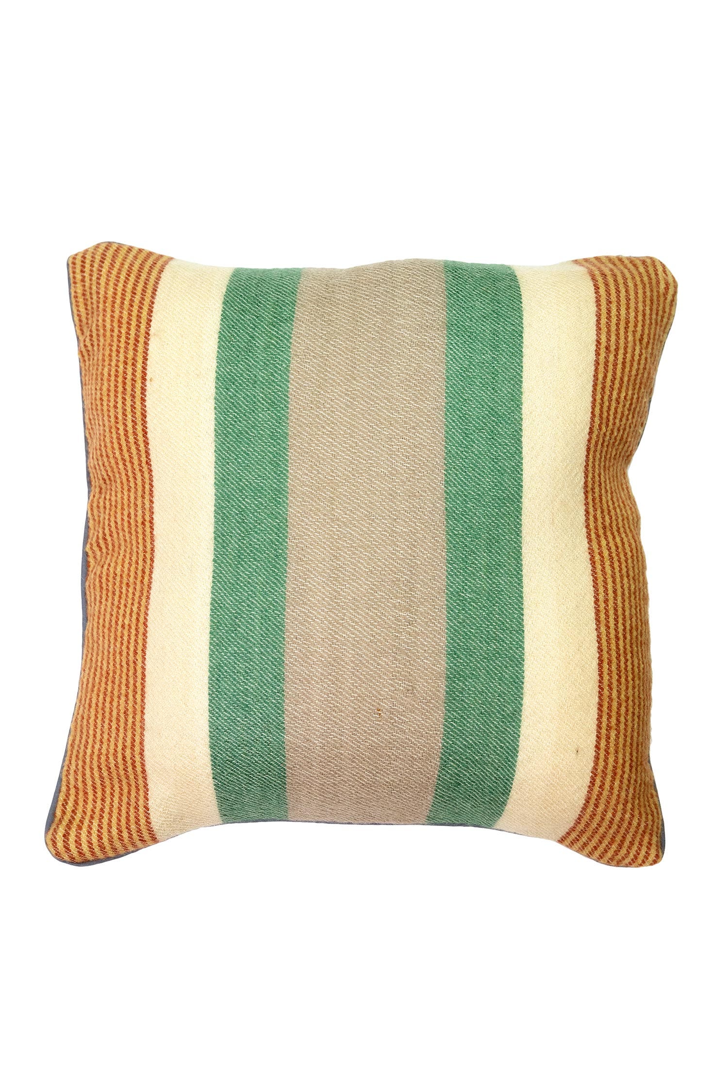 Artisan striped handwoven pillow on a modern sofa, showcasing its unique design.