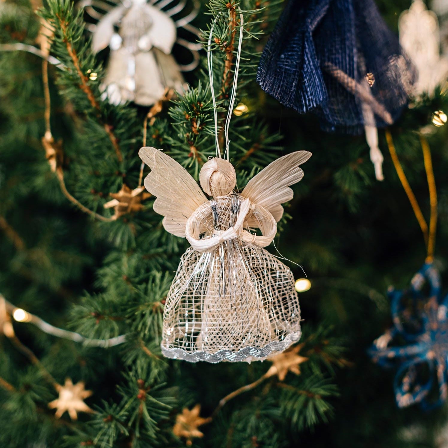 Heavenly angel figurine showcasing its intricate sinamay weave from natural fibers.