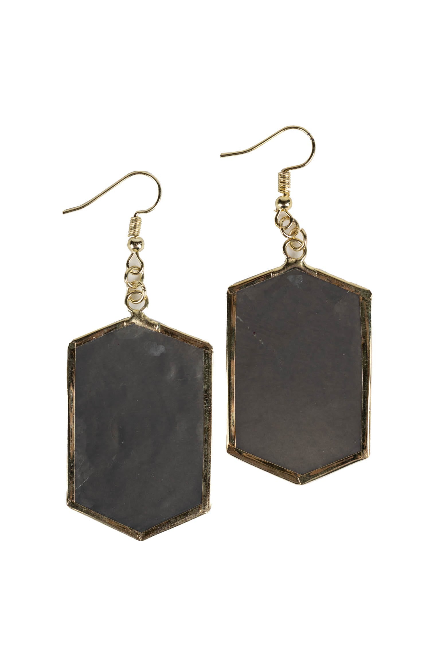 Close-up of elegant gray capiz earrings showcasing intricate craftsmanship