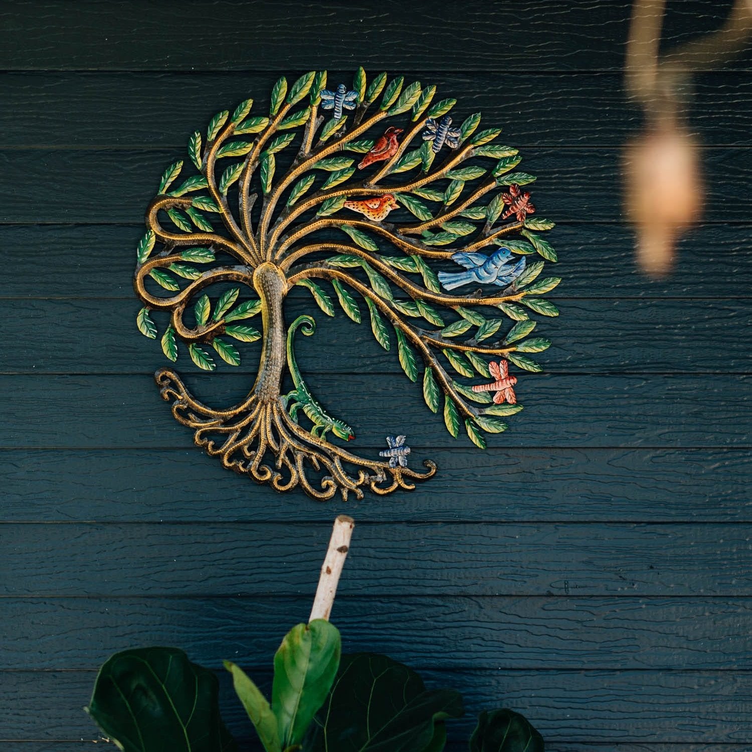 Close-up of intricate cut metal Haitian art from recycled steel drums