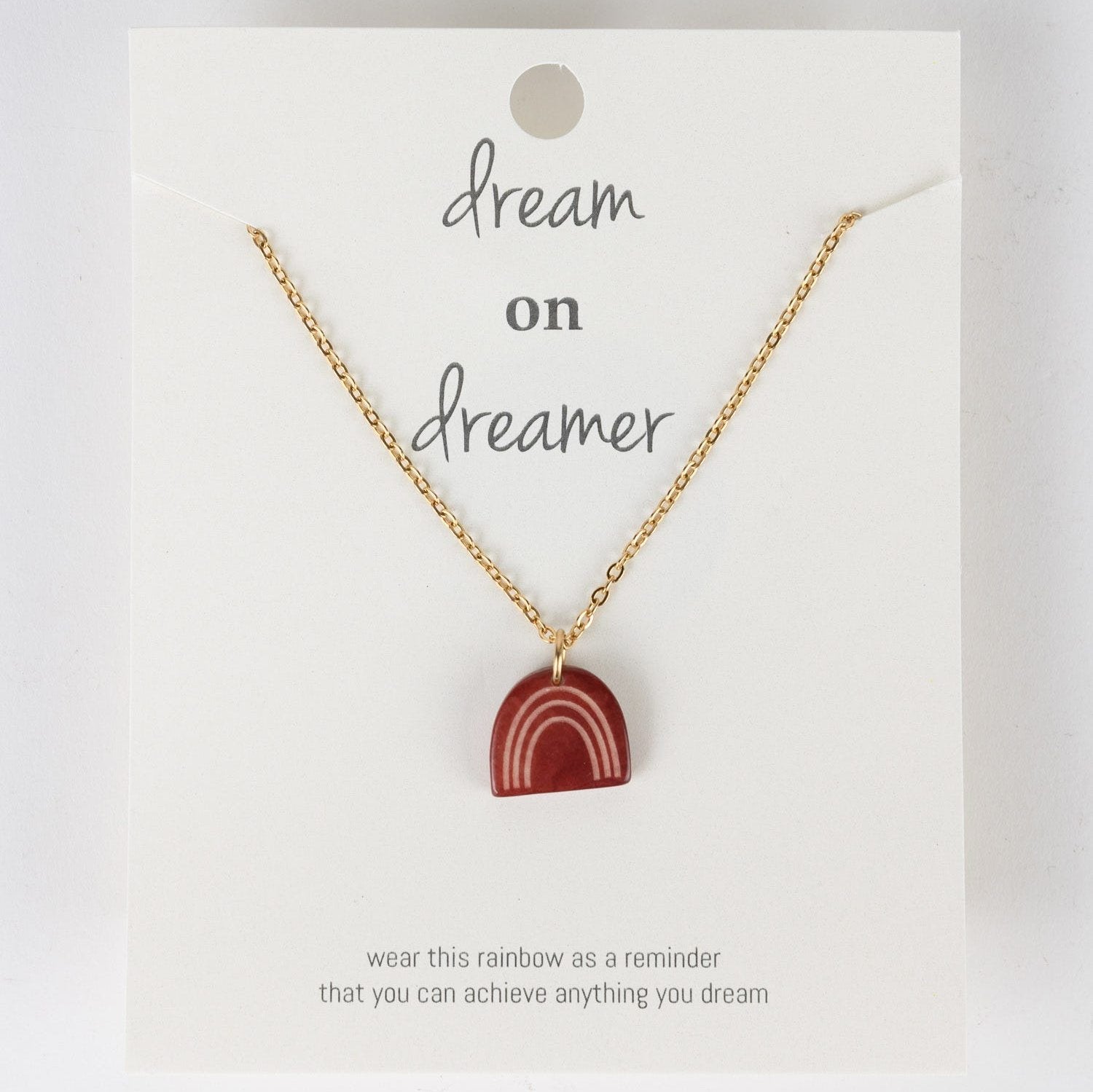 Close-up of the Vibrant Dreams necklace showcasing the rainbow tagua charm.