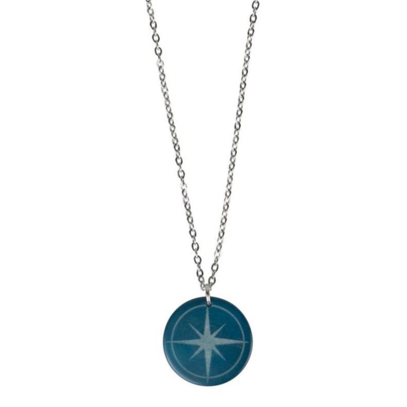 North Star travel charm necklace close-up showcasing tagua craftsmanship.