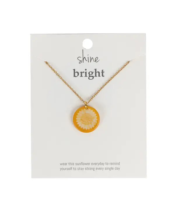 Close-up of the Radiant Earth tagua necklace showcasing hand-etched details and rich natural tones.
