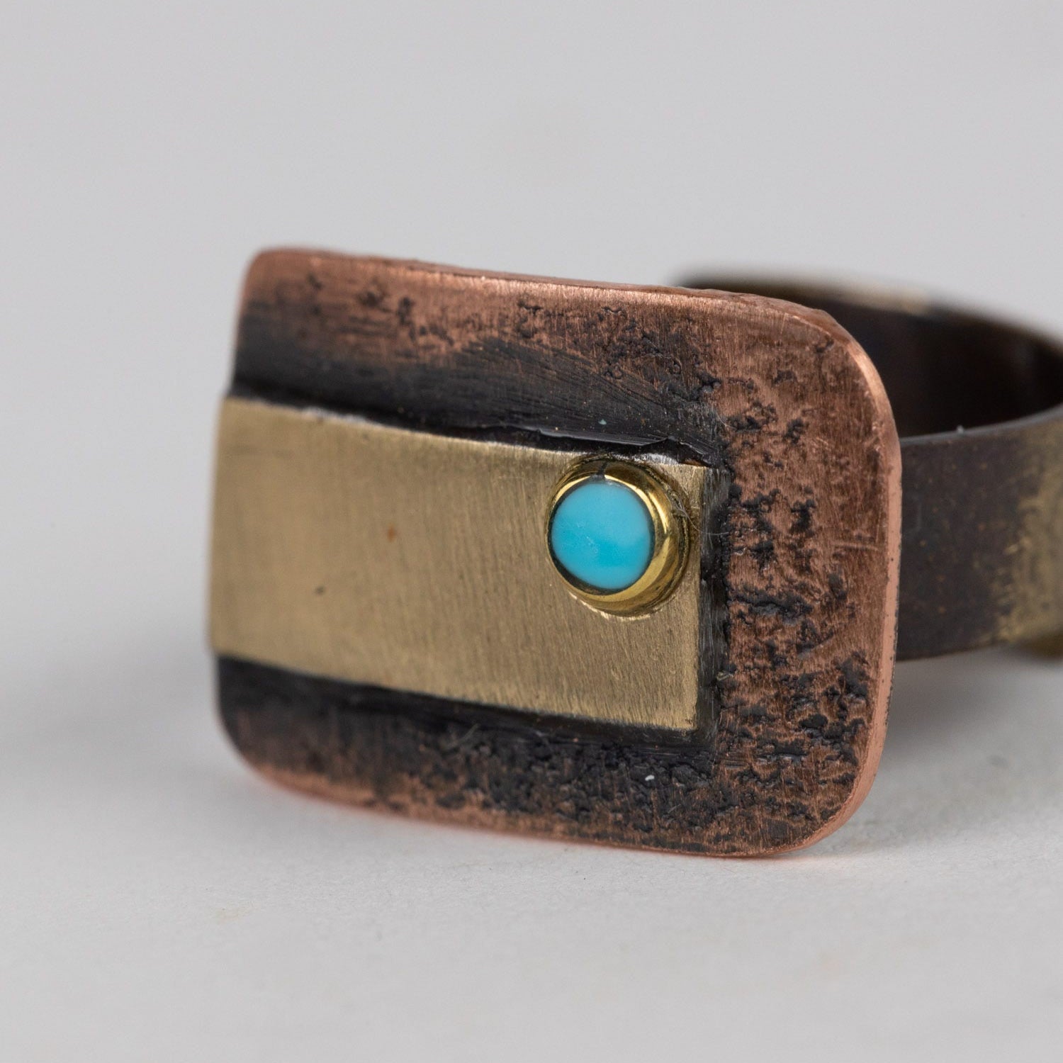 Front view of the handmade hammered copper ring showcasing artisan design
