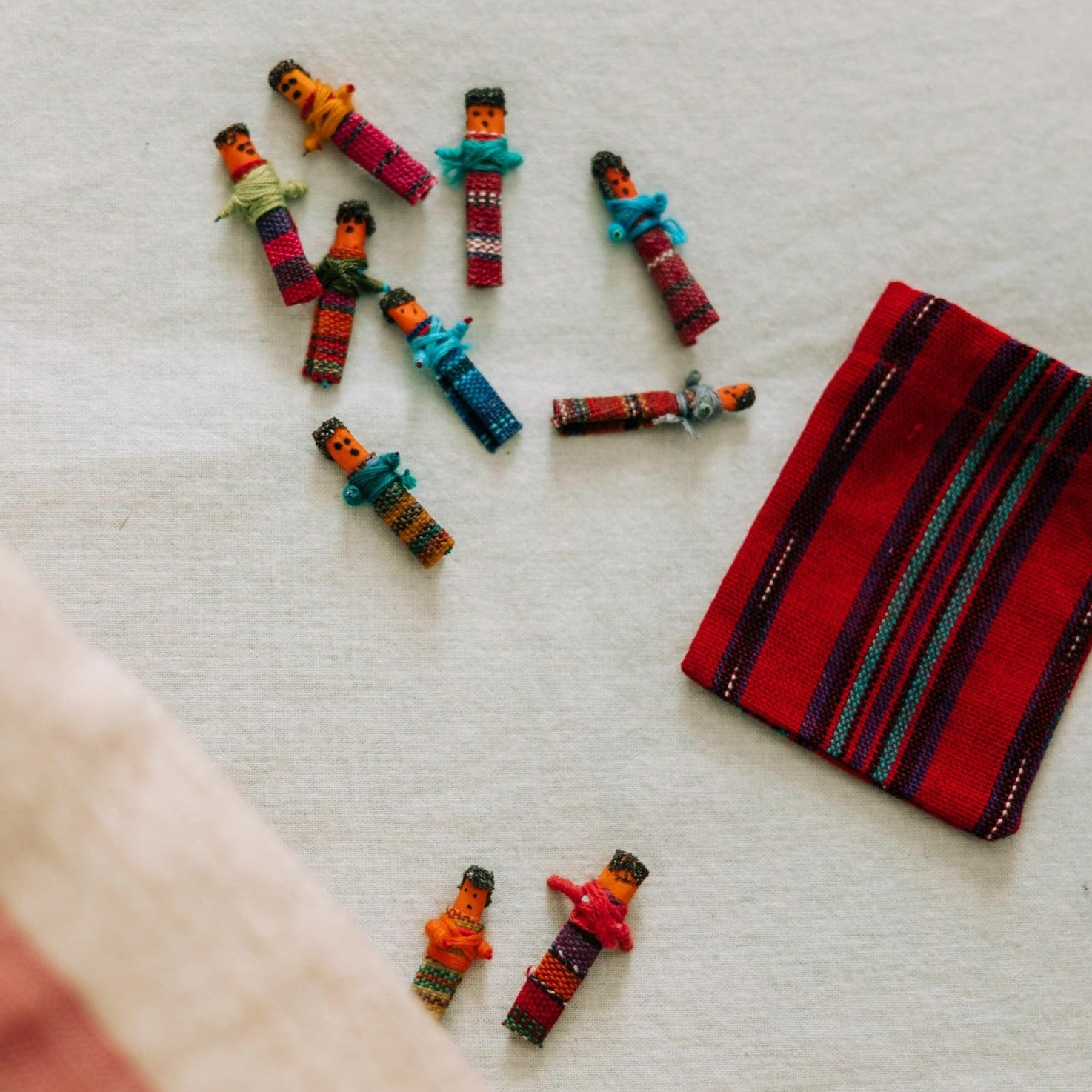 Close-up of handmade Guatemalan worry dolls with colorful clothing