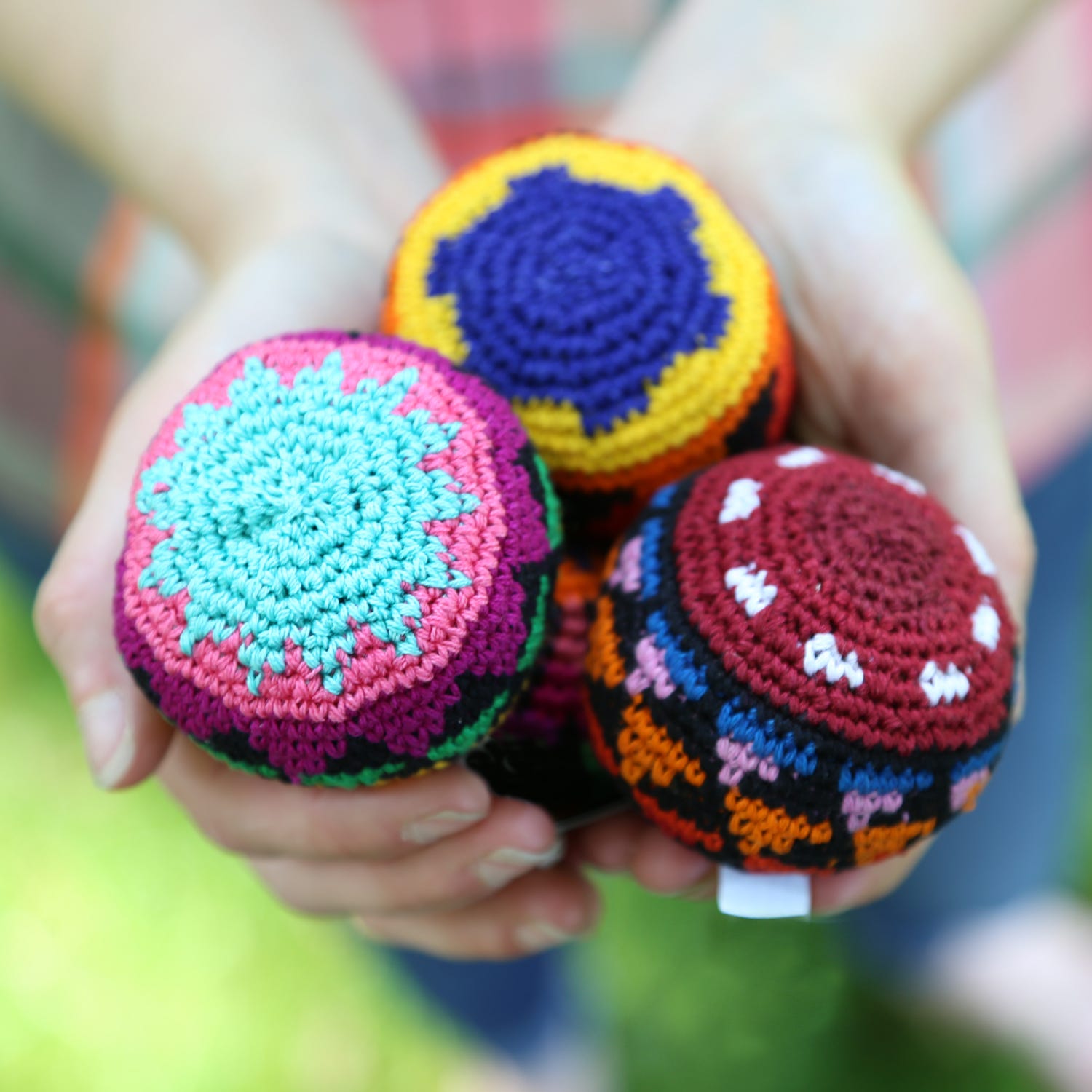 Colorful crochet hacky sack with geometric design for kids and adults
