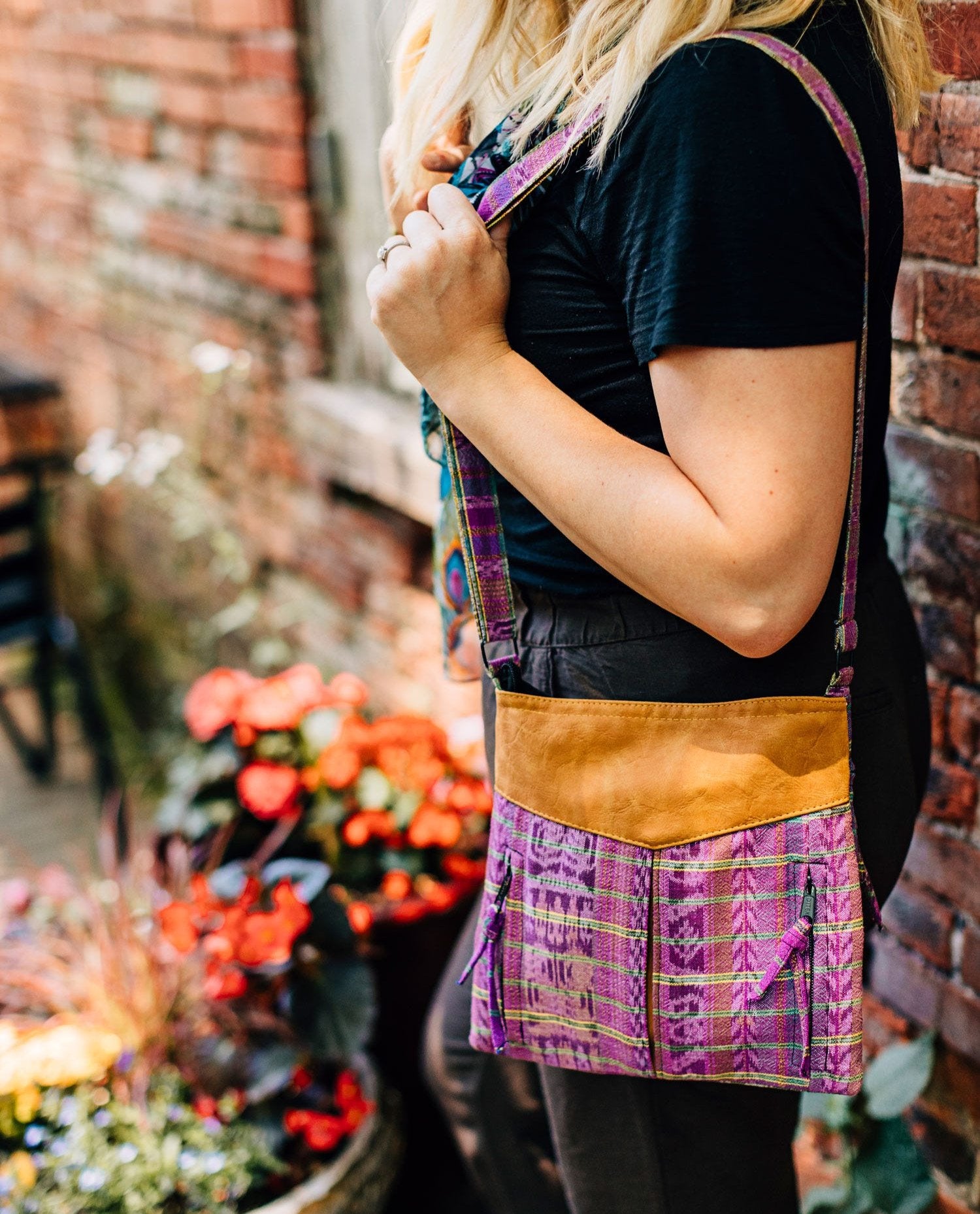 Front view of handmade Guatemalan cotton bag showing dual zipper pockets with tassels