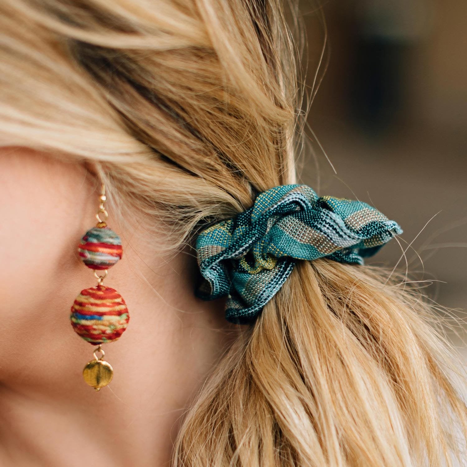 A vibrant Explorer's Premium Handcrafted Scrunchie in use during an outdoor adventure, showcasing its durable design.