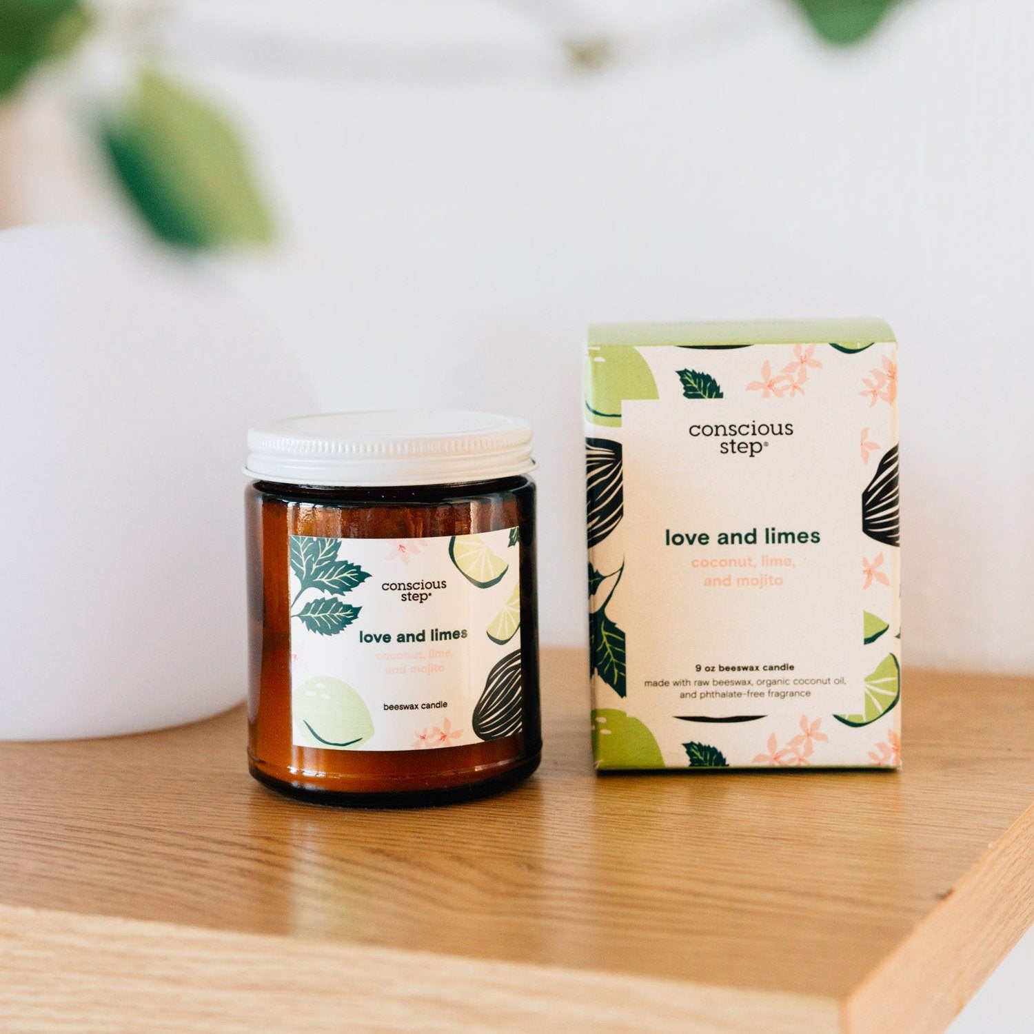 Close-up of Love & Limes citrus and mint scented candle with bright flames, highlighting fresh scent and vibrant colors