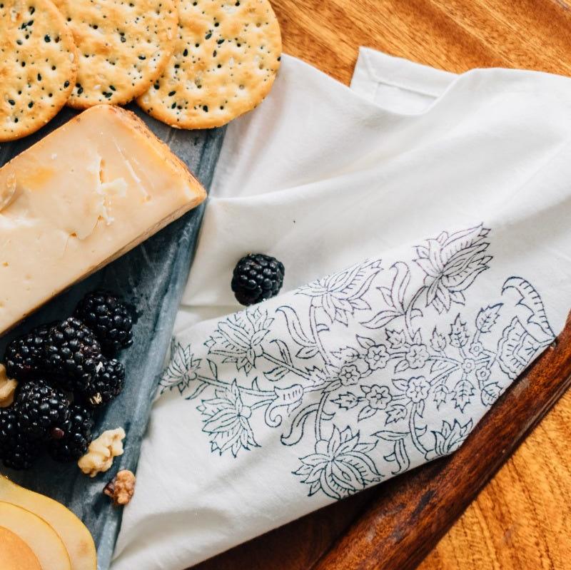 Close-up of artisan hand-printed navy and white handmade napkin