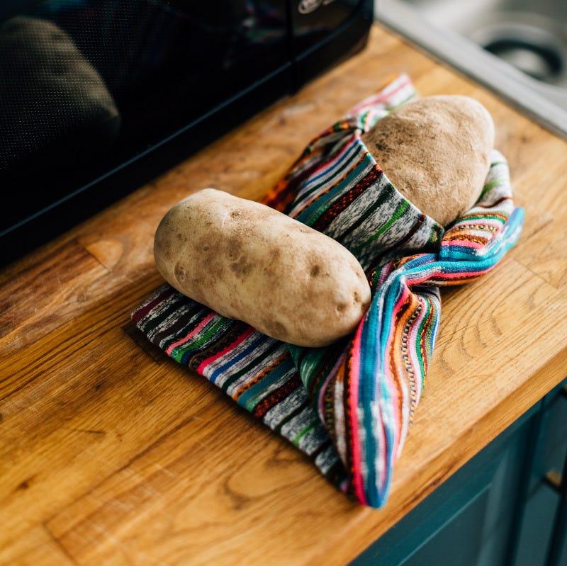 Using the cotton microwave pouch to reheat a potato in the microwave