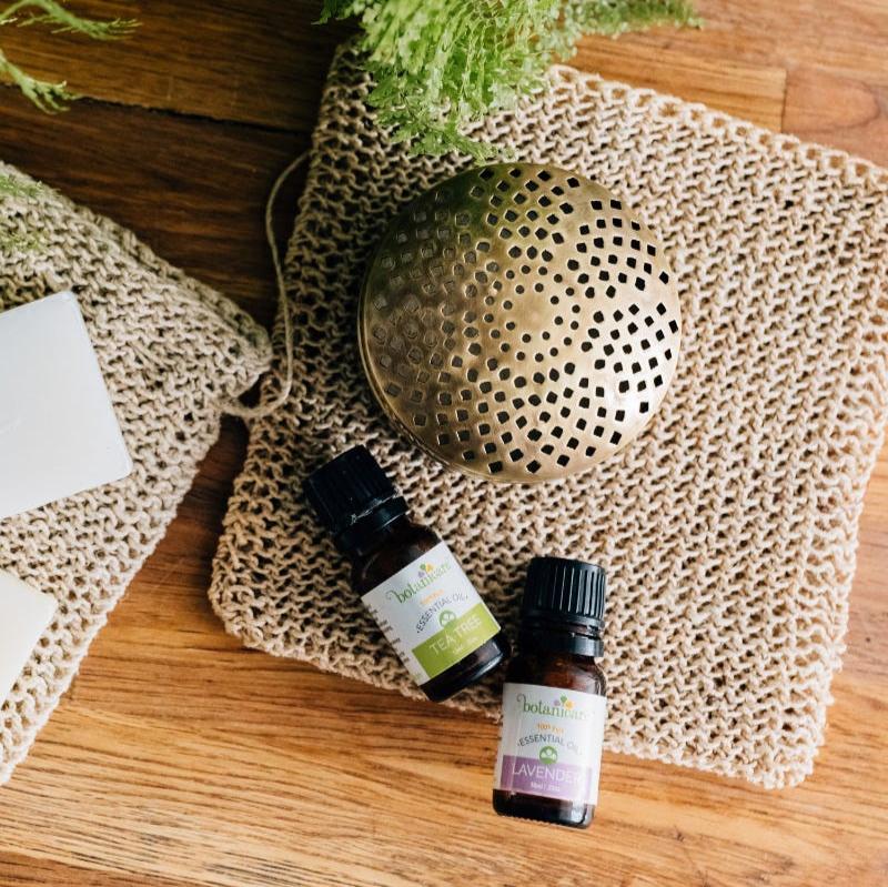 Top-rated wellness diffuser with brass case in a cozy living room setting.