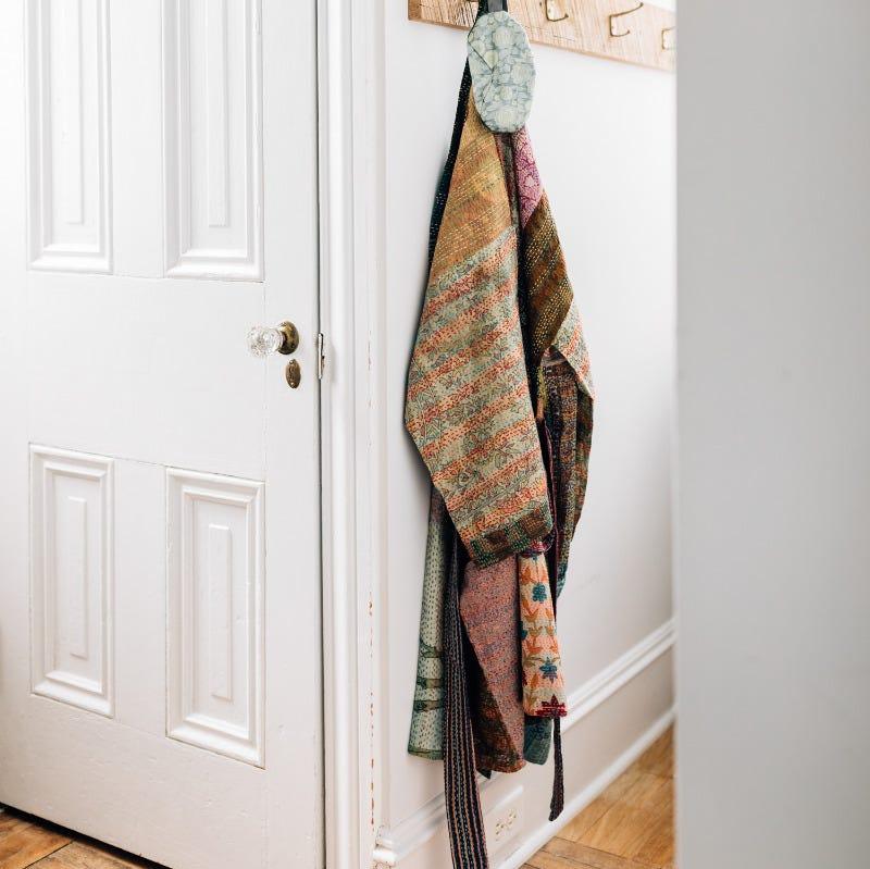 Close-up of hand-embroidered Kantha stitch on sari bathrobe showcasing traditional craftsmanship