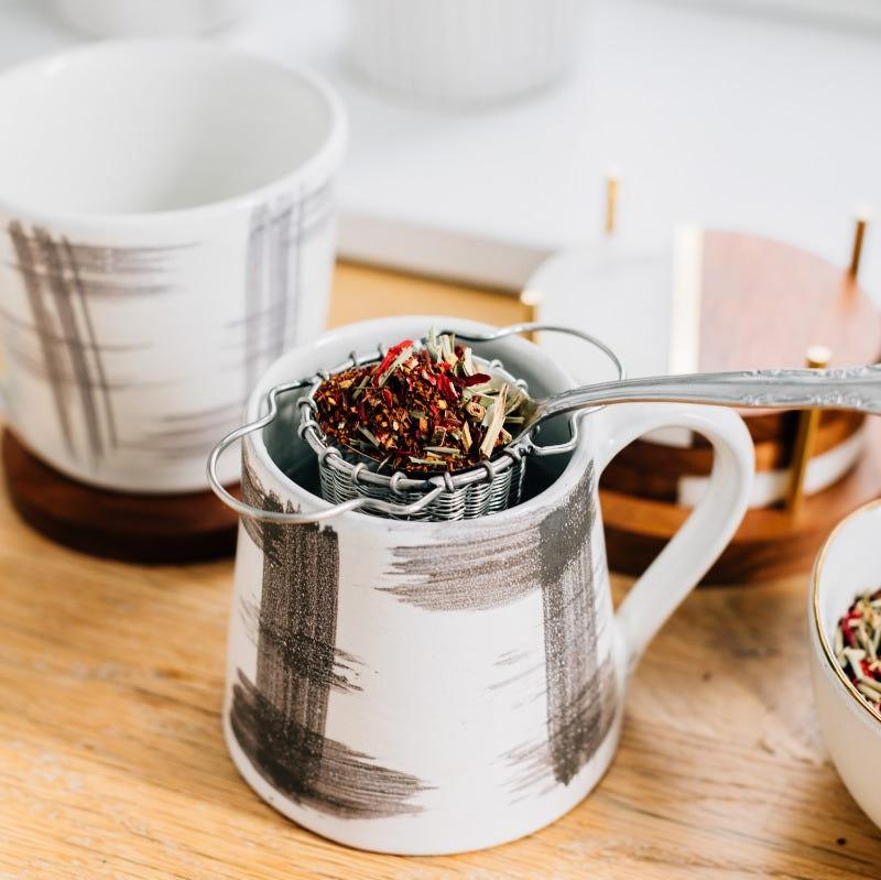 Close-up of stainless steel tea strainer with fine mesh for loose tea