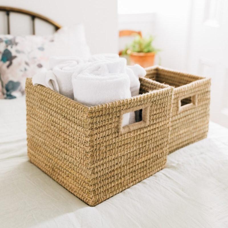 Versatile storage basket on a shelf, demonstrating its functionality in home organization.
