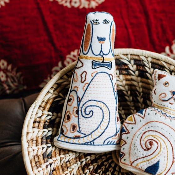 Front view of the artisan embroidered dog plush toy highlighting its intricate details.